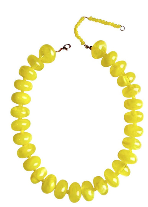 Yellow beaded necklace on a white background