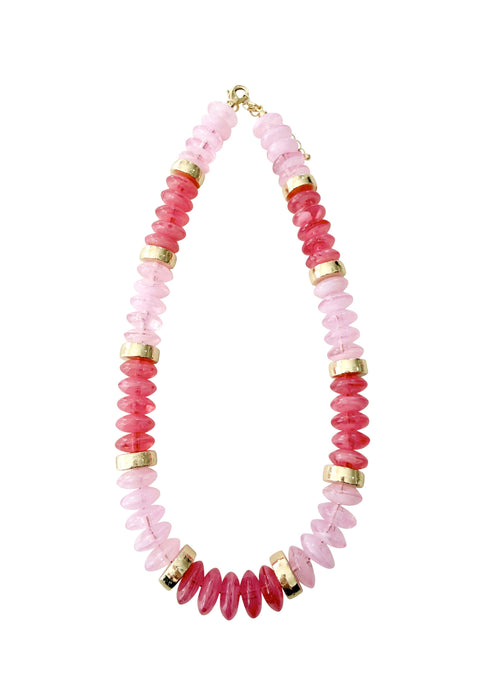 Necklace with pink and gold beads on a white background