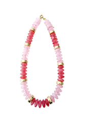Necklace with pink and gold beads on a white background