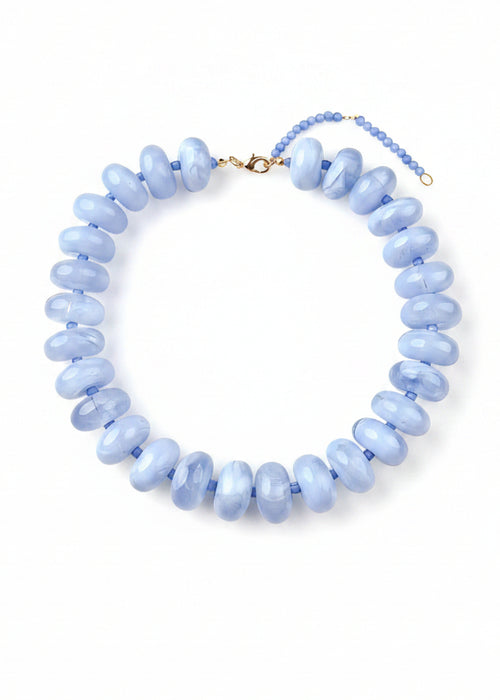 Necklace with light blue beads on a white background