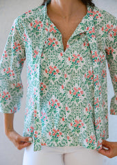 Floral patterned blouse with a plain background
