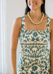 Woman wearing a floral dress with a white background
