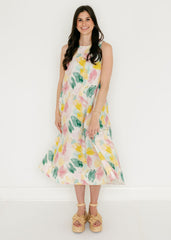 Woman wearing a floral dress against a white background