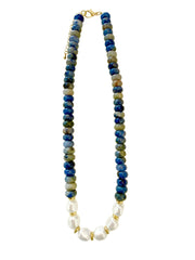 A beaded necklace featuring dark blue and green stone beads with a section of white baroque pearls, finished with gold-tone hardware and clasp.