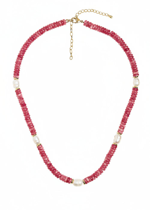 Necklace with pink beads and gold accents on a white background