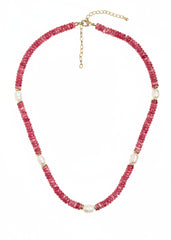 Necklace with pink beads and gold accents on a white background