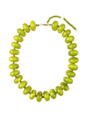 Necklace with green beads on a white background