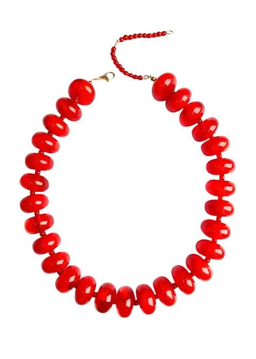 Red beaded necklace on a white background