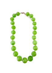 Necklace with green beads on a white background