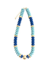 Necklace with blue and turquoise beads on a white background